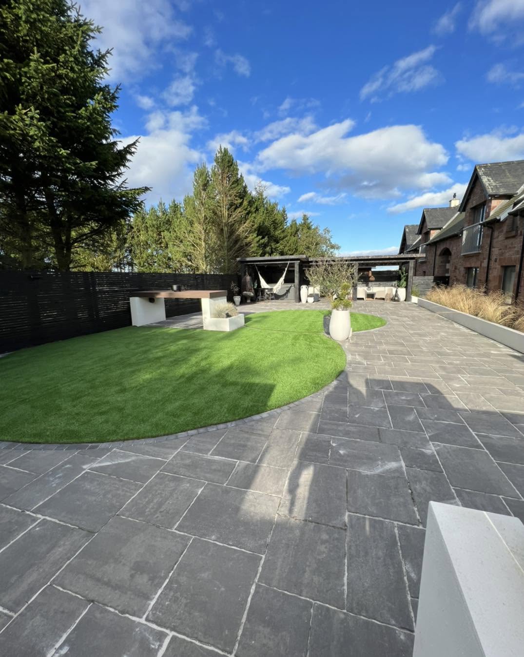 Premium landscaped garden with porcelain patio and artificial lawn by 360 Contracts